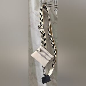 Stylish Cream Crossbody Bag with Black Strap